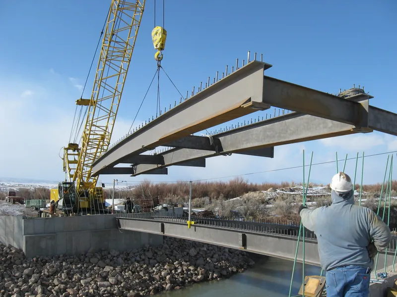 A crane setting steel bridge girders